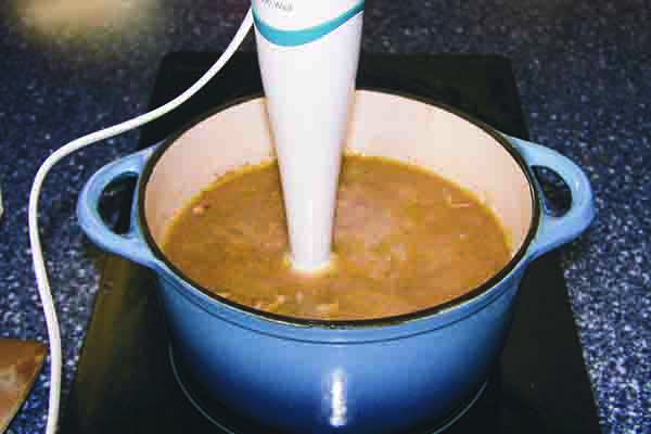 6. Blend the soup (the plunger blender is the most convenient), optionally adding water so that the soup is not too thick, nor too liquid. Adjust seasoning with salt and pepper. Serve hot with a dollop of cream on top of each bowl.
